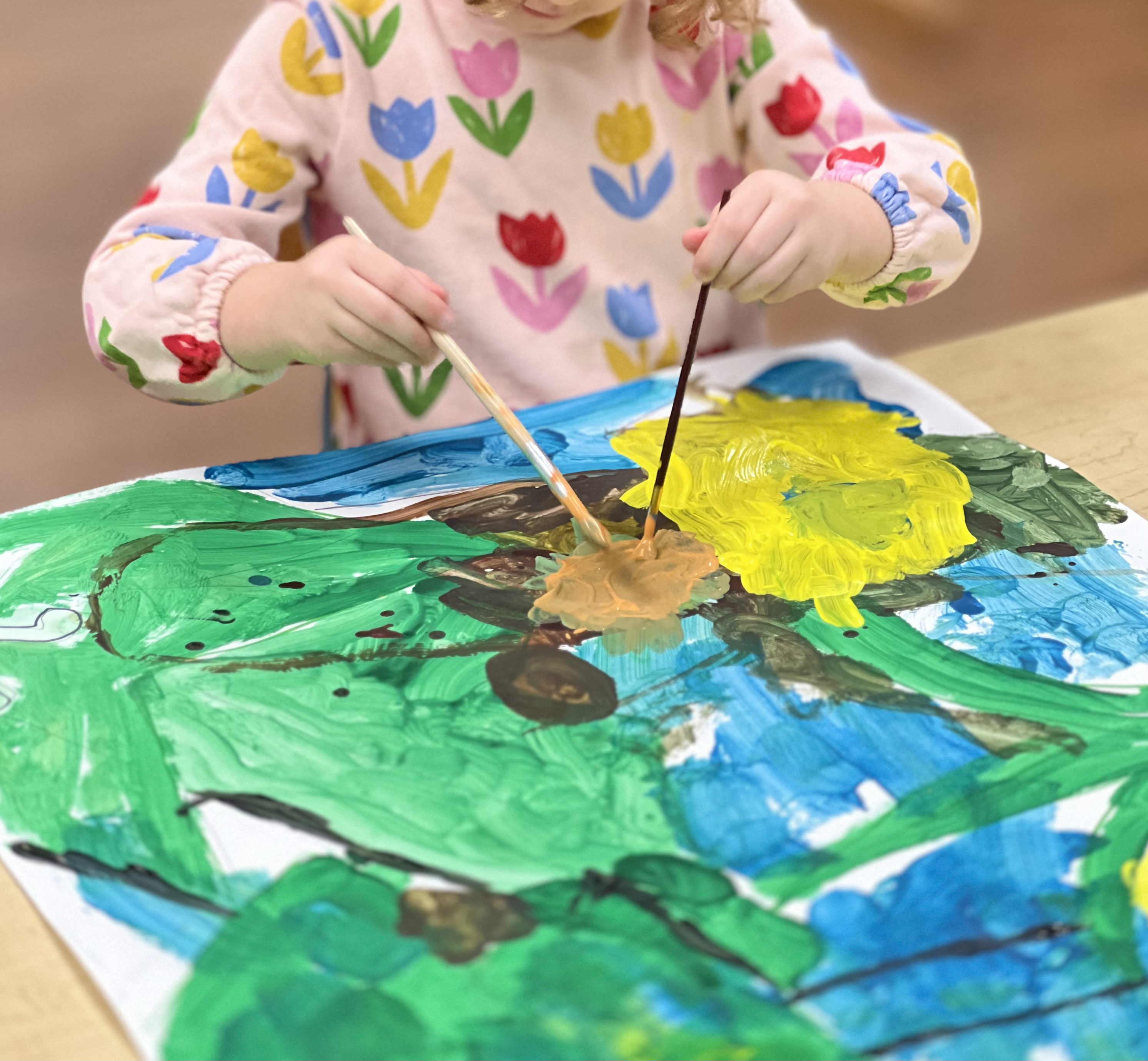 Preschool-aged child tempera painting.