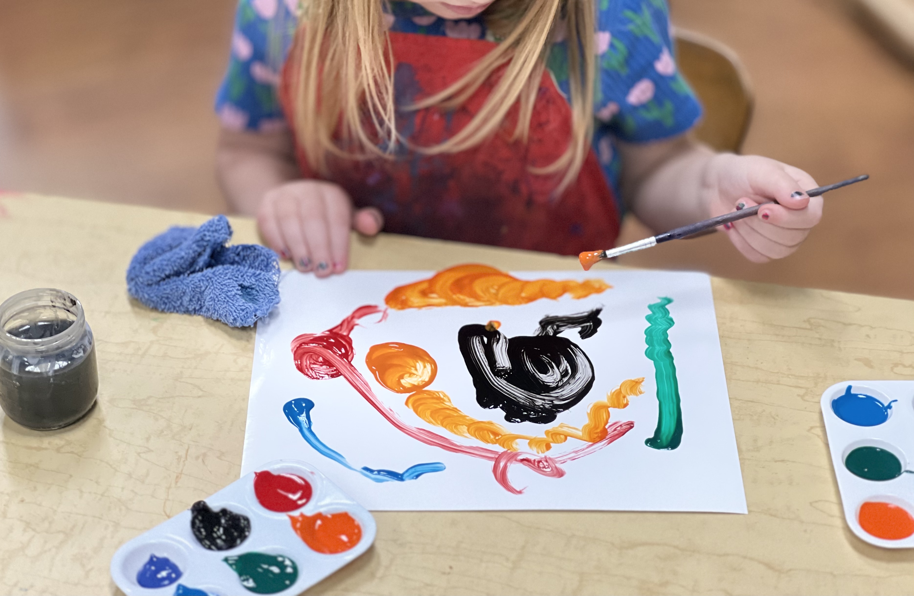 Preschool-aged child tempera painting.